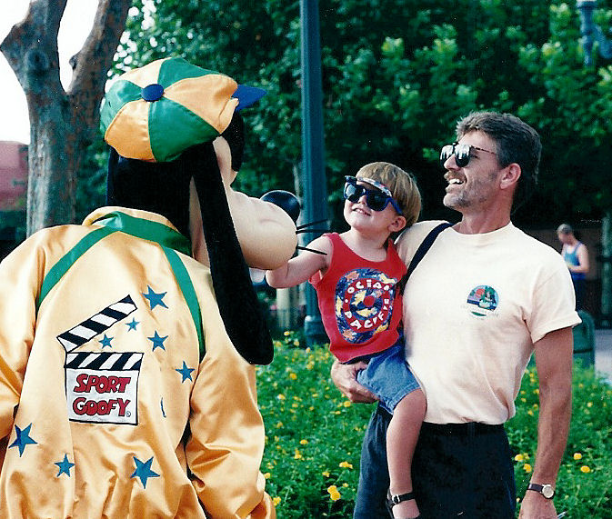 Dad holding Max with Goofy.