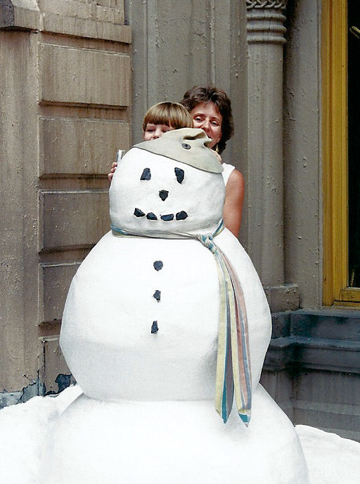 Max and Mom behind the snowman at MGM Studios.