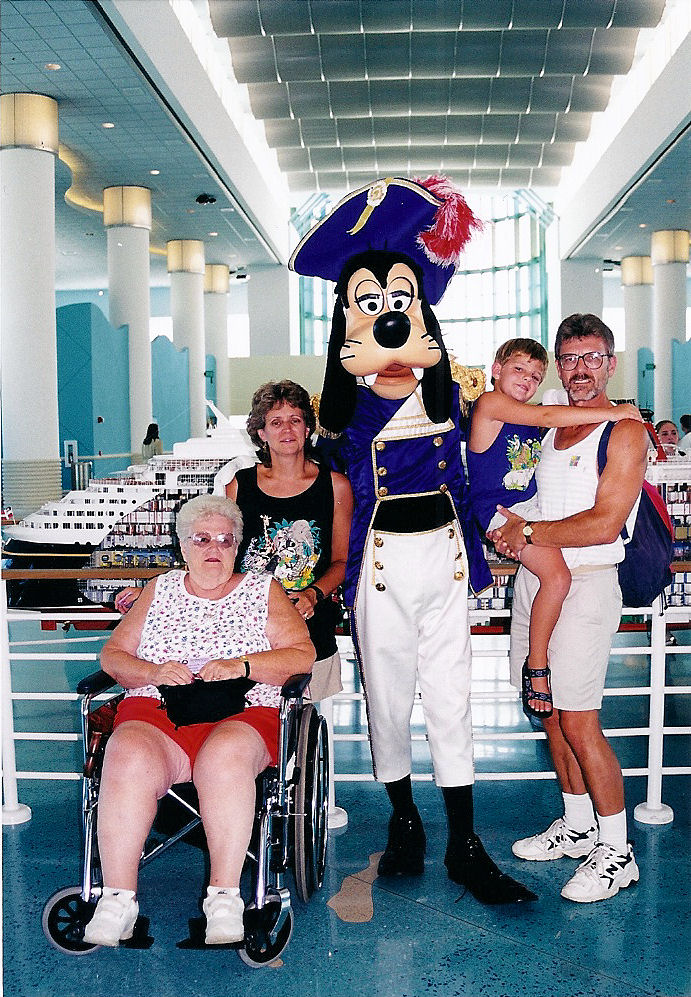 From left to right: my grandmother, my mother, Captain Goofy, me, and my dad, right before we got on the ship for the Disney Cruise Line. From left to right: my grandmother, my mother, Captain Goofy, me, and my dad, right before we got on the ship for the Disney Cruise Line.