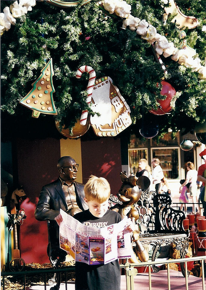 Me looking at a map right by a Christmas tree on Main Street U.S.A. in The Magic Kingdom, Disney World. Me looking at a map right by a Christmas tree on Main Street U.S.A. in The Magic Kingdom, Disney World.