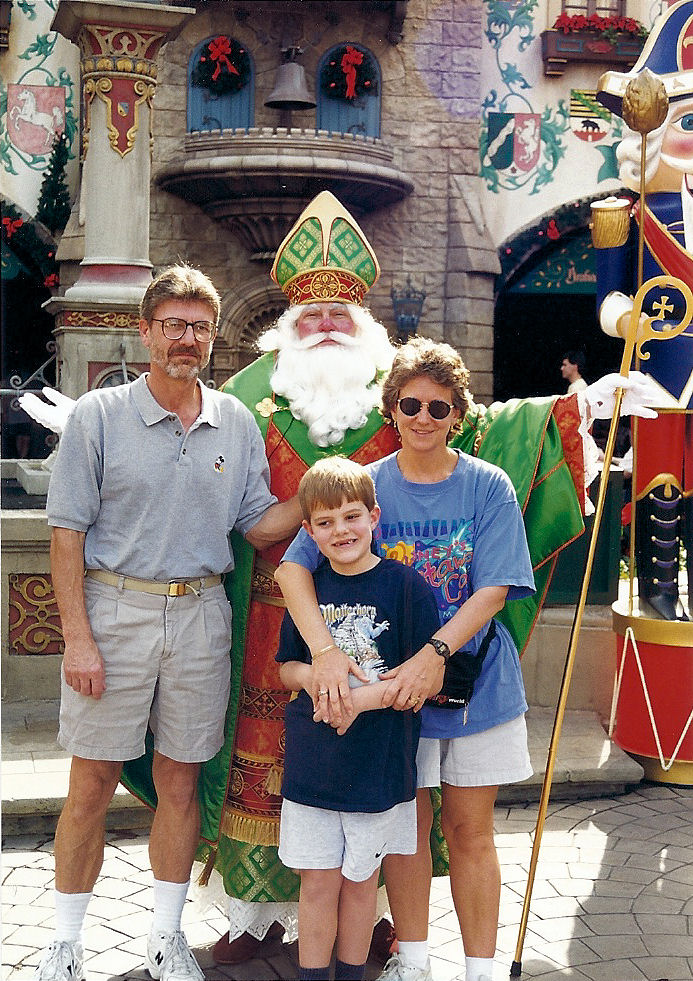 My mom, my dad, and I in the Germany Pavilion at EPCOT at Christmas time posing with St. Nicholas. My mom, my dad, and I in the Germany Pavilion at EPCOT at Christmas time posing with St. Nicholas.