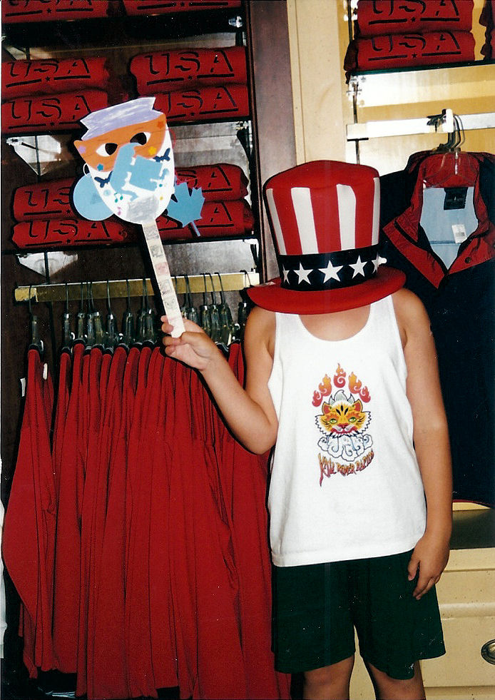 Me at the American Pavilion at EPCOT with a hat on that is a little too big.