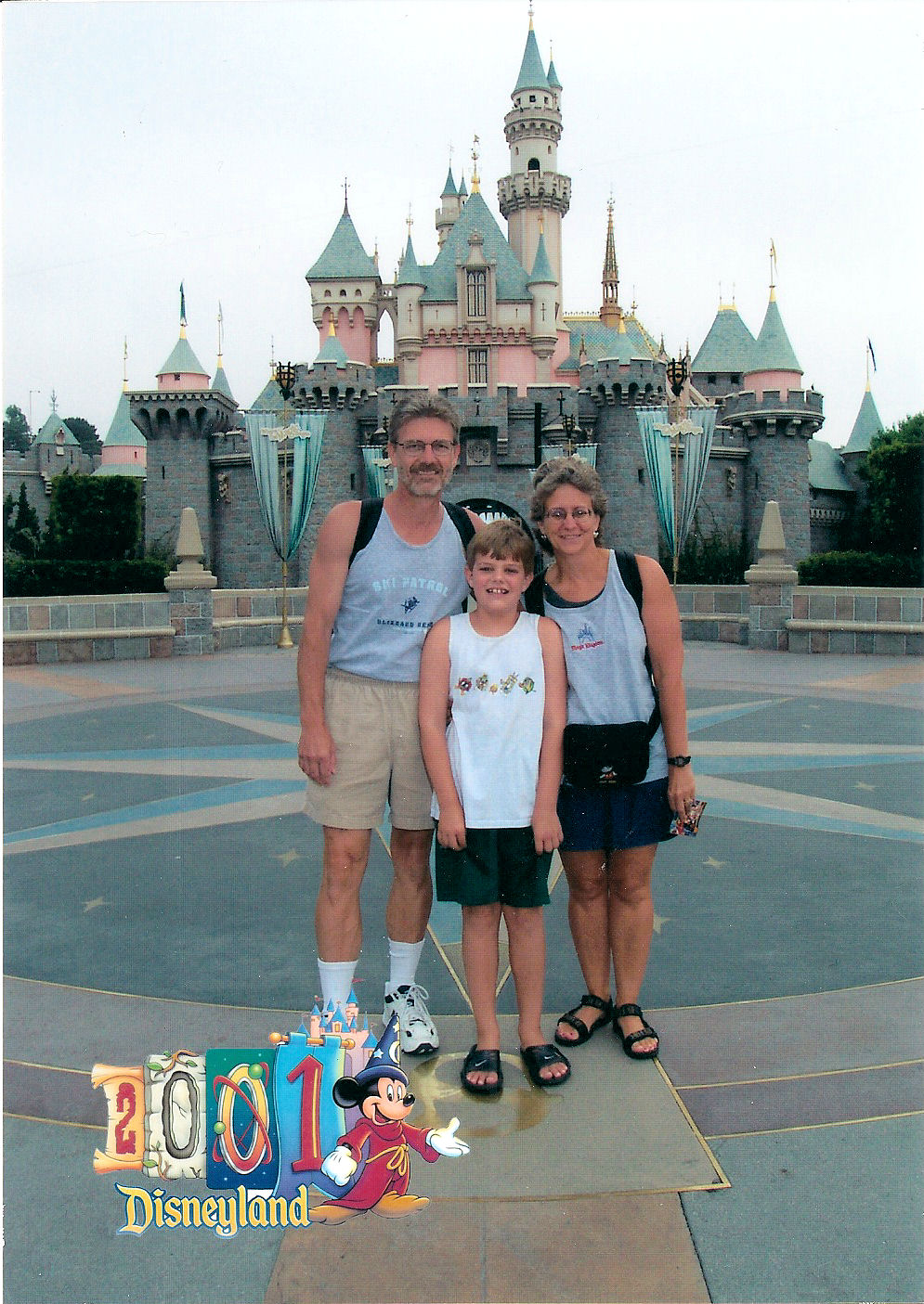 My parents and I in front of Sleeping Beauty Castle at Disneyland.