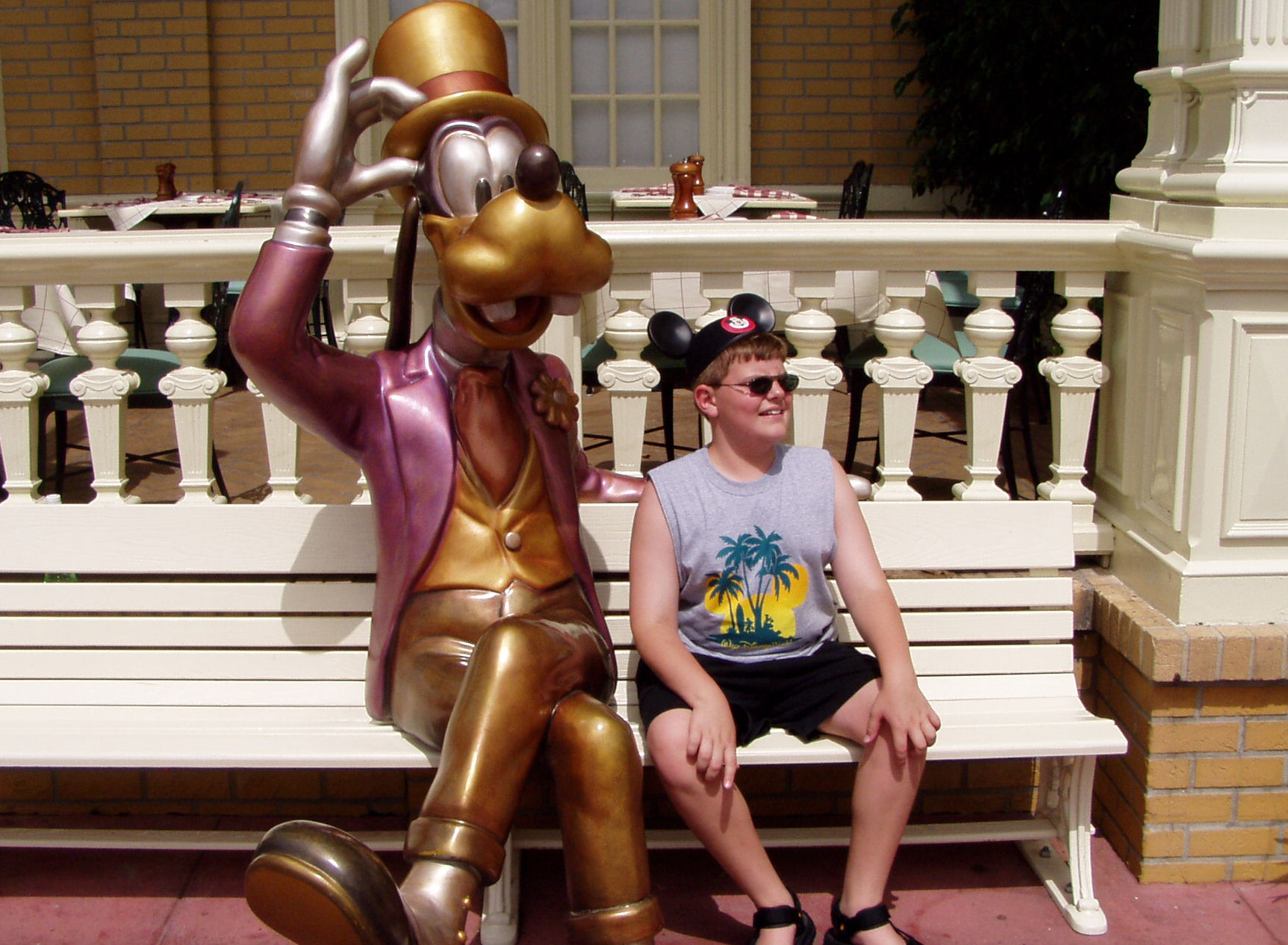 Me sitting next to Goofy on Main Street U.S.A. at The Magic Kingdom at Disney World.
