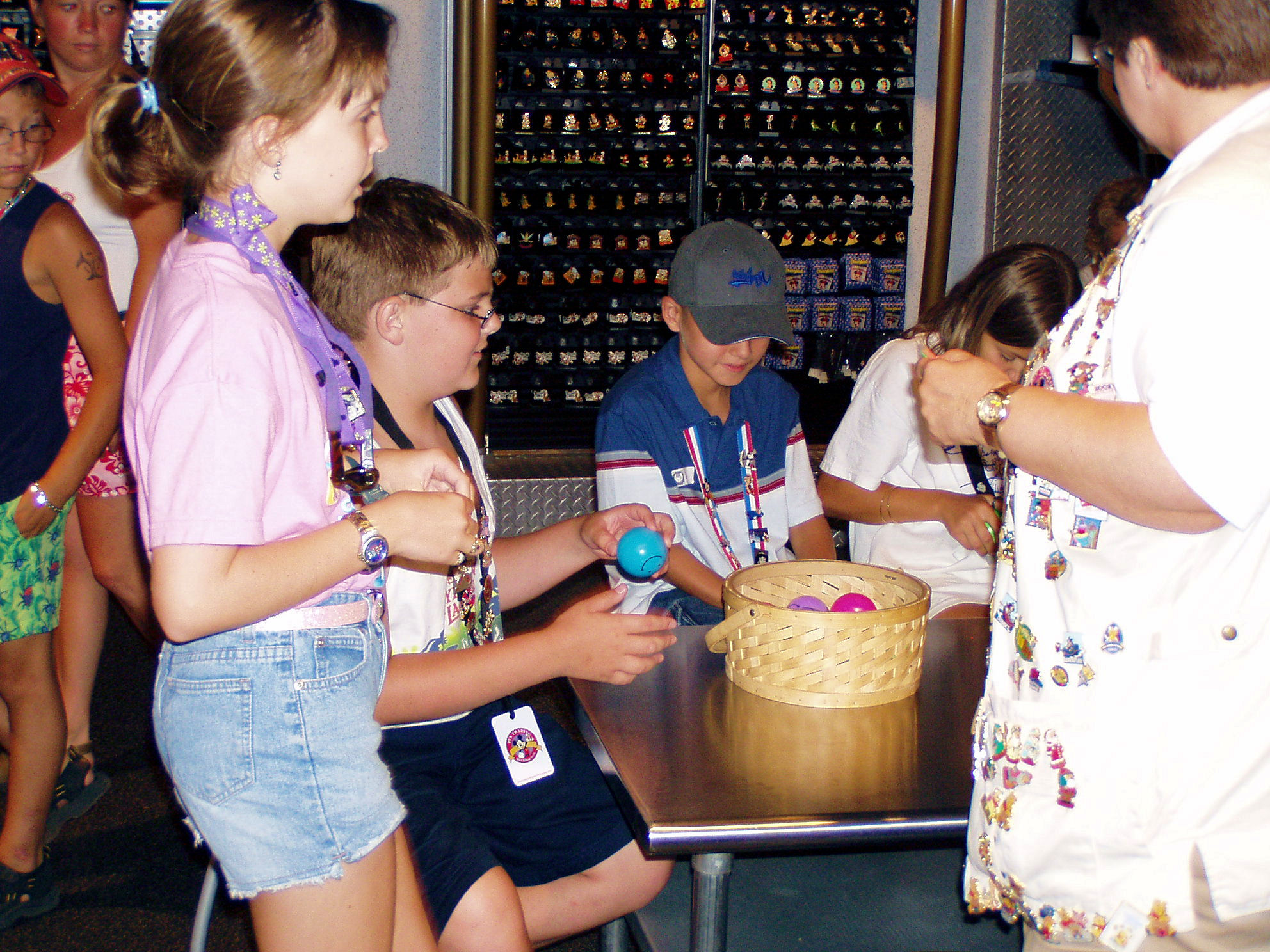 Me taking a pin trading class and getting a blue smiley face ball at Disneyland.