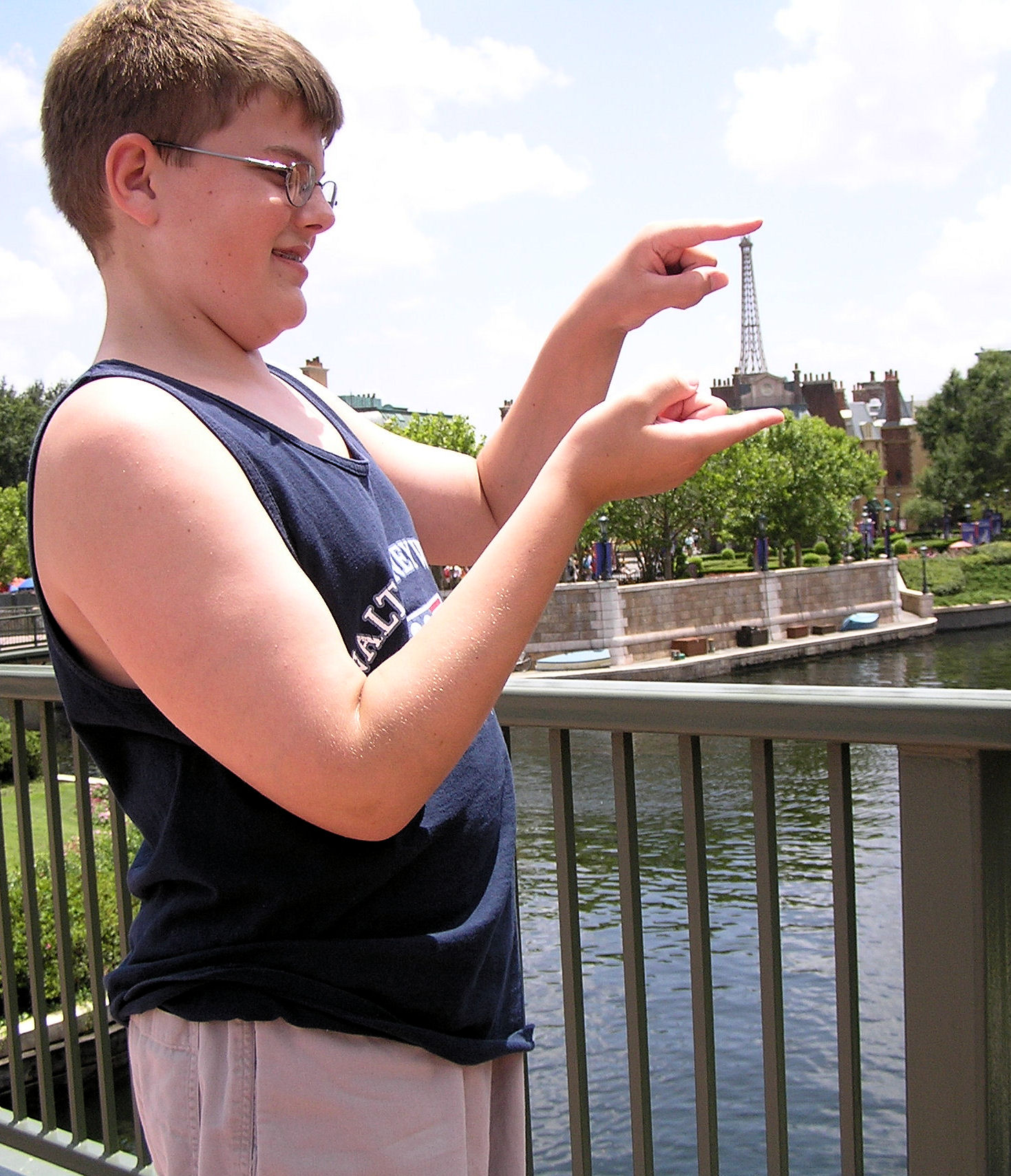 Me holding the Eiffel Tower at the France Pavilion at EPCOT.