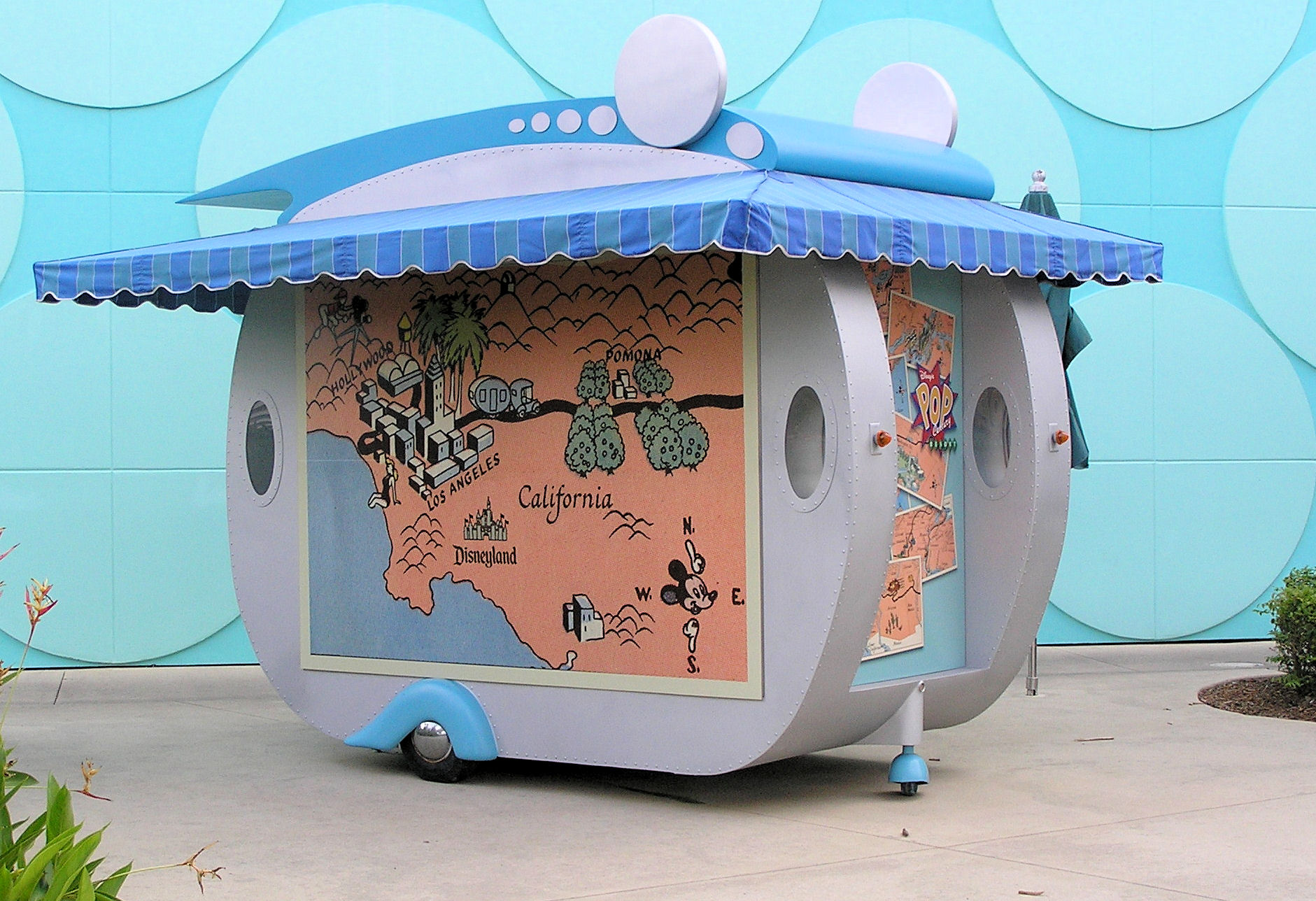 A stand with a map of part of California on it in front of Disney's Pop Century Resort at Disney World. A stand with a map of part of California on it in front of Disney's Pop Century Resort at Disney World.