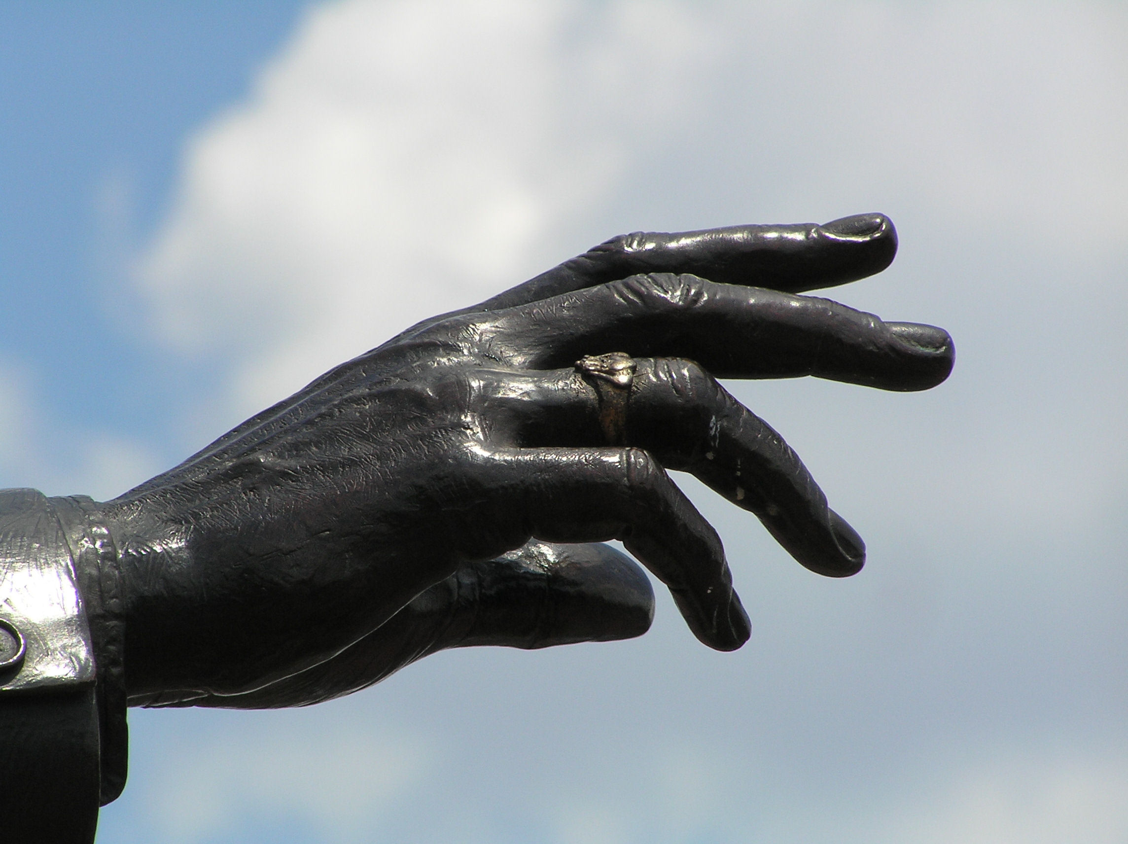 Walt Disney's outstretched hand on the Partners' Statue at The Magic Kingdom at Disney World. Walt Disney's outstretched hand on the Partners' Statue at The Magic Kingdom at Disney World.