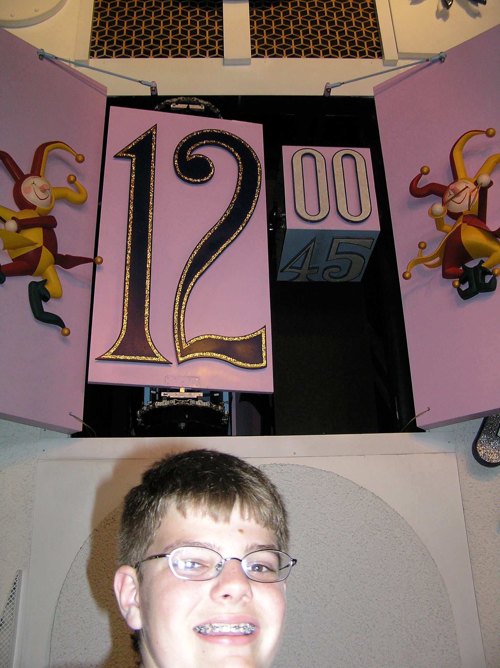 Here I am in front of the clock at It's A Small World at the Magic Kingdom at Disney World as it strikes noon. Here I am in front of the clock at It's A Small World at the Magic Kingdom at Disney World as it strikes noon.