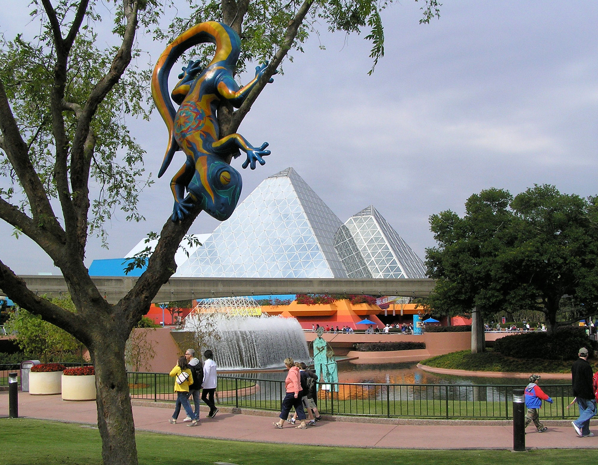 A gecko in a tree in front of the Imagination Pavilion at EPCOT. A gecko in a tree in front of the Imagination Pavilion at EPCOT.