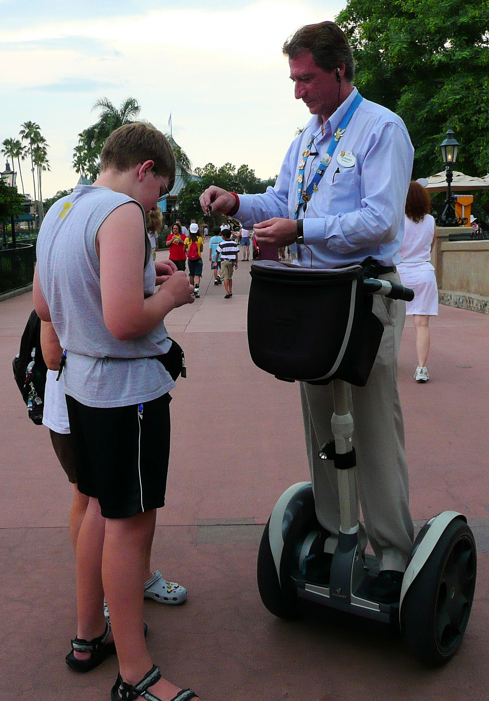 Pin trading with a cast member on a Segway. Pin trading with a cast member on a Segway.