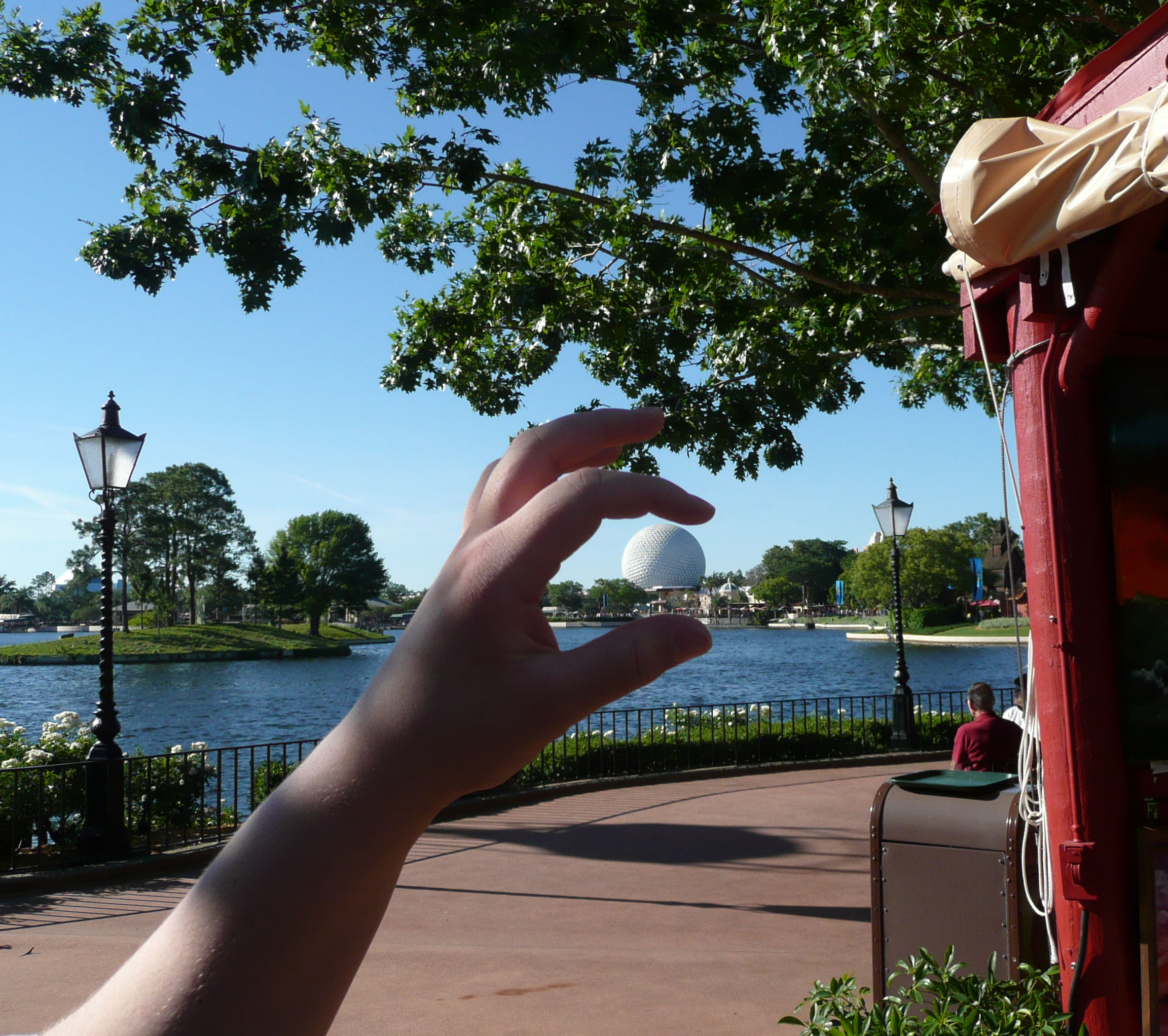 Holding Spaceship Earth in my fingers, EPCOT. Holding Spaceship Earth in my fingers, EPCOT.