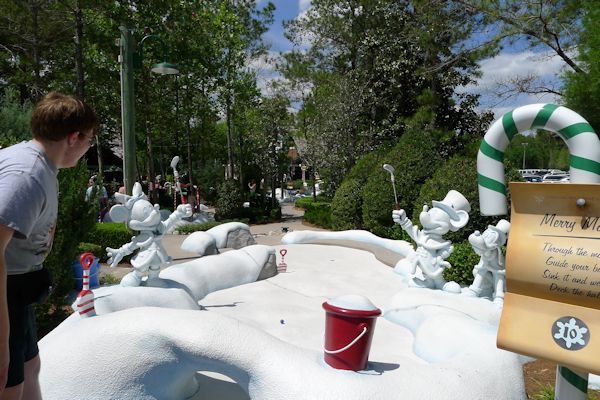 Playing miniature golf at Disney's Winter Summerland near Blizzard Beach.