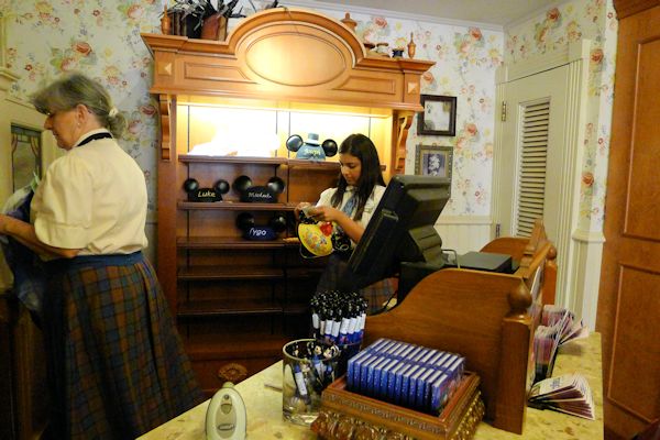 She's putting my name on my ears.